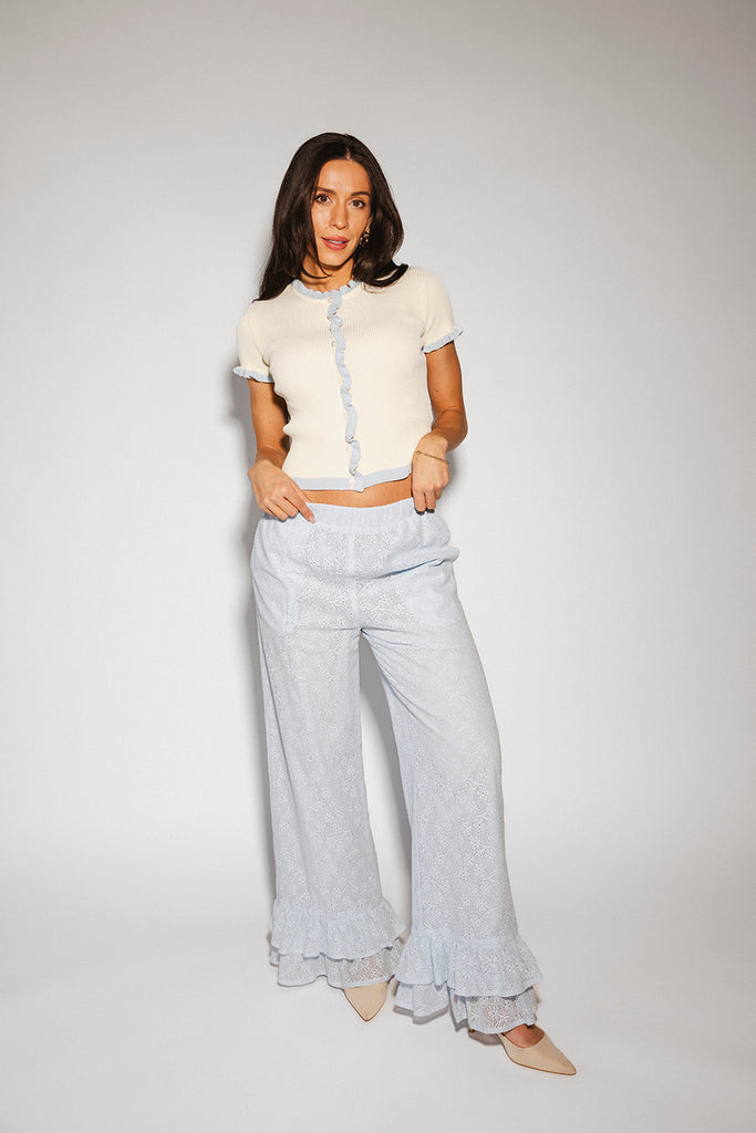 vintage-inspired short sleeve fitted top with blue ruffle details. the perfect elevated basic to dress up or down for any outfit idea.
