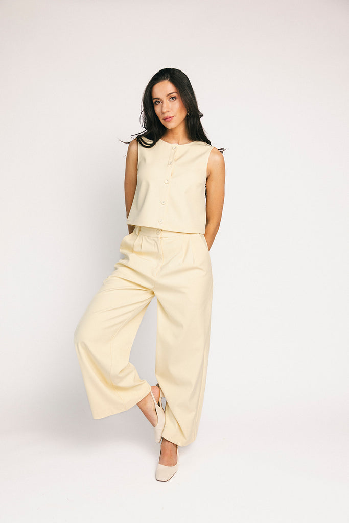 butter yellow pant set with a cropped button up tank + high waisted trousers. the perfect elevated set for the office + everyday wear. 
