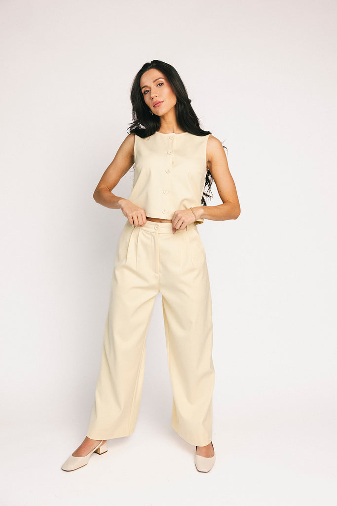 butter yellow pant set with a cropped button up tank + high waisted trousers. the perfect elevated set for the office + everyday wear. 
