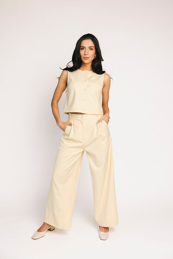 butter yellow pant set with a cropped button up tank + high waisted trousers. the perfect elevated set for the office + everyday wear. 
