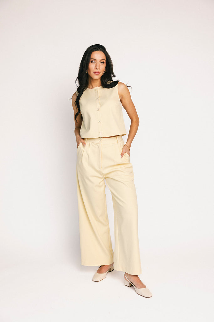 butter yellow pant set with a cropped button up tank + high waisted trousers. the perfect elevated set for the office + everyday wear. 
