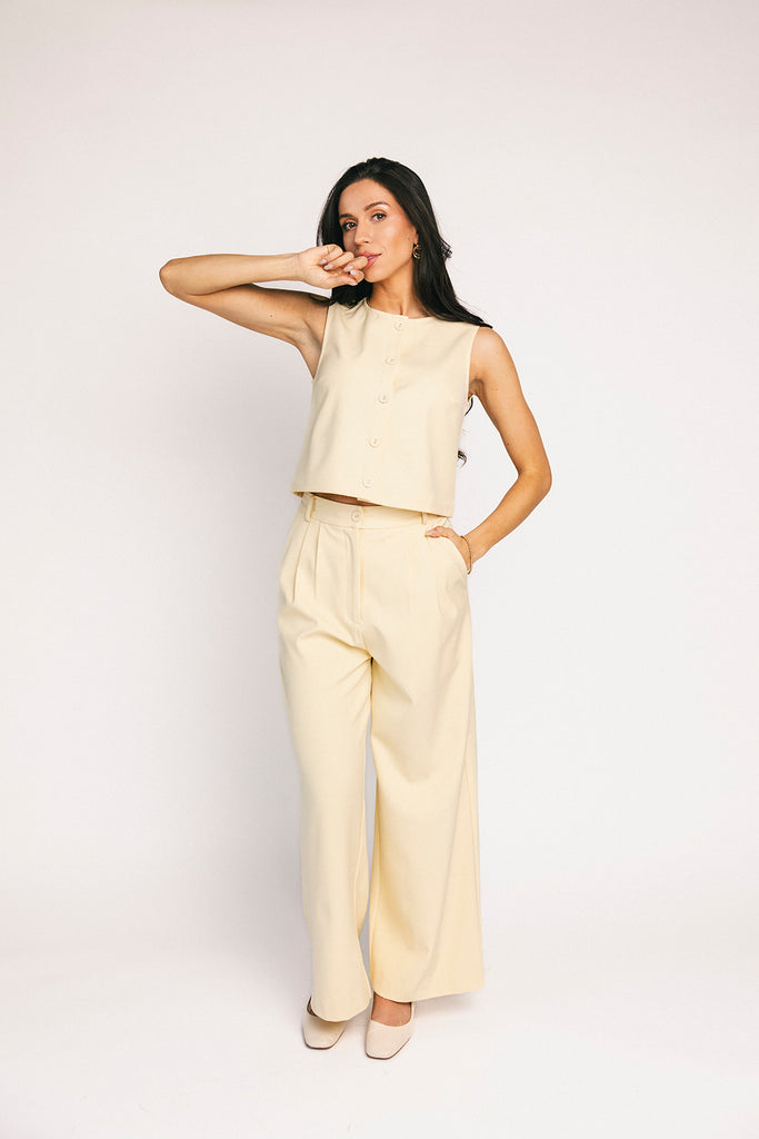 butter yellow pant set with a cropped button up tank + high waisted trousers. the perfect elevated set for the office + everyday wear. 
