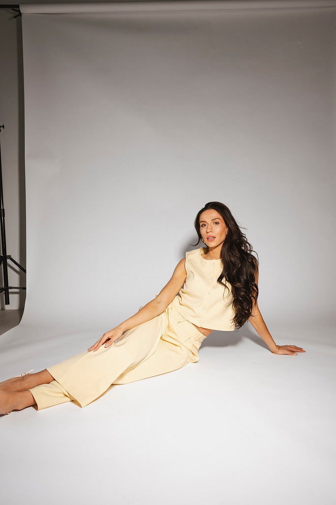 butter yellow pant set with a cropped button up tank + high waisted trousers. the perfect elevated set for the office + everyday wear. 
