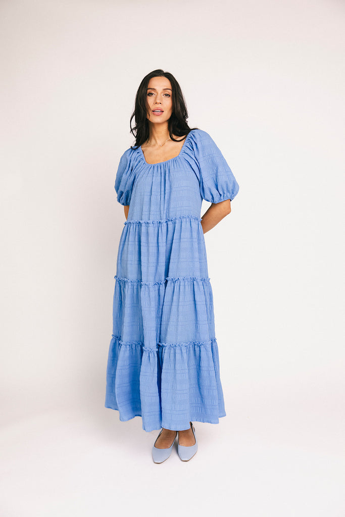 zoco daymaker dress: puff sleeve blue maxi dress with an elastic neckline. perfect for weddings, baby showers, and family pictures.
