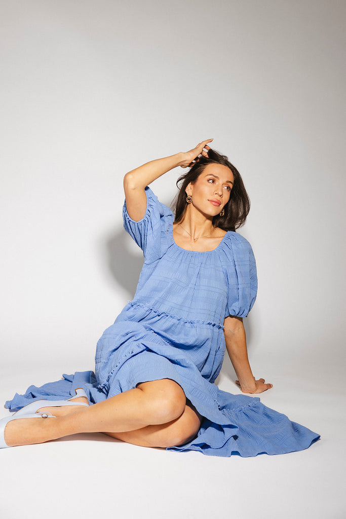 zoco daymaker dress: puff sleeve blue maxi dress with an elastic neckline. perfect for weddings, baby showers, and family pictures.

