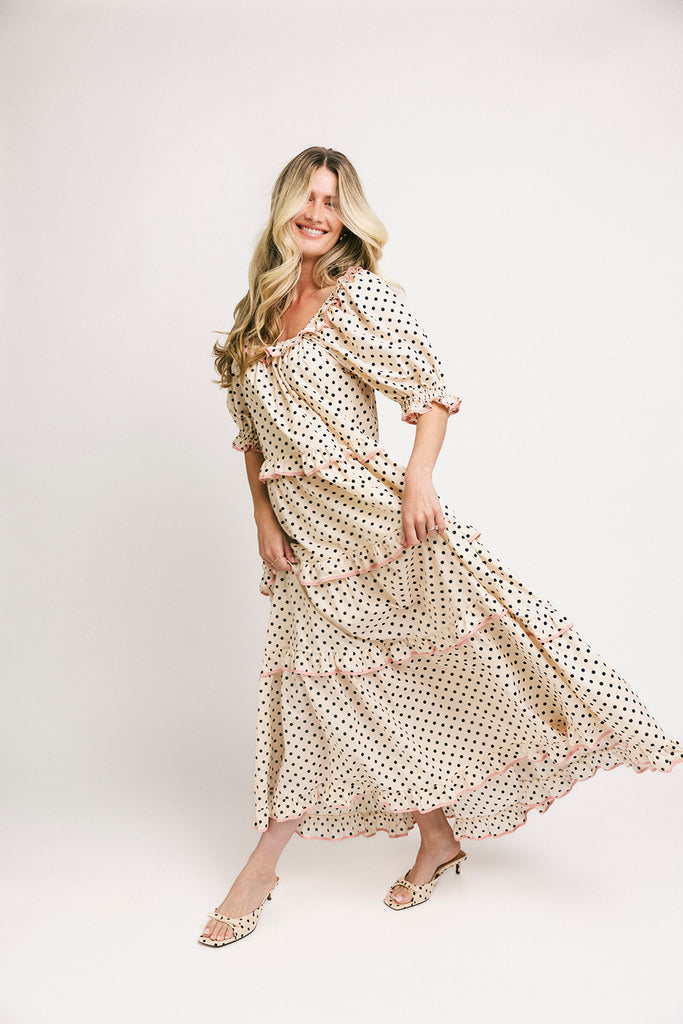 zoco daymaker dress: puff sleeve polka dot dress with an elastic neckline and pink trim details. perfect for weddings, baby showers, and family pictures.