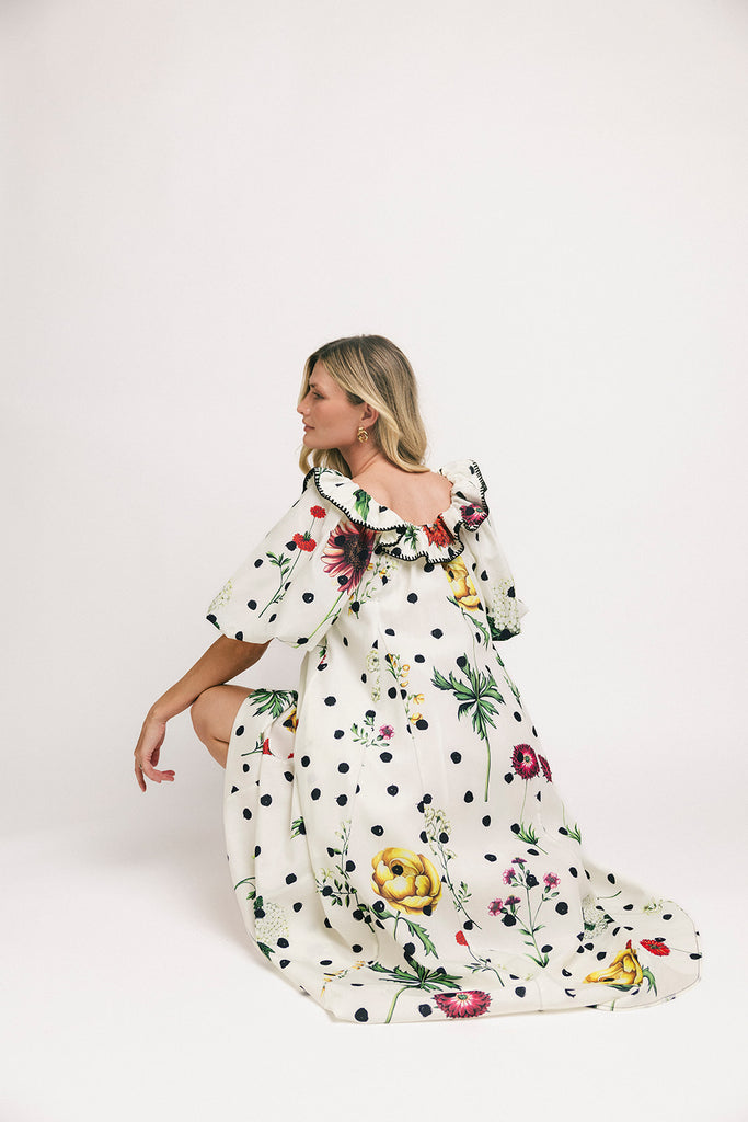 a polka dot puff sleeve dress with floral print details. the perfect polka dot midi dress for baby showers, family pictures, + special occasions. 
