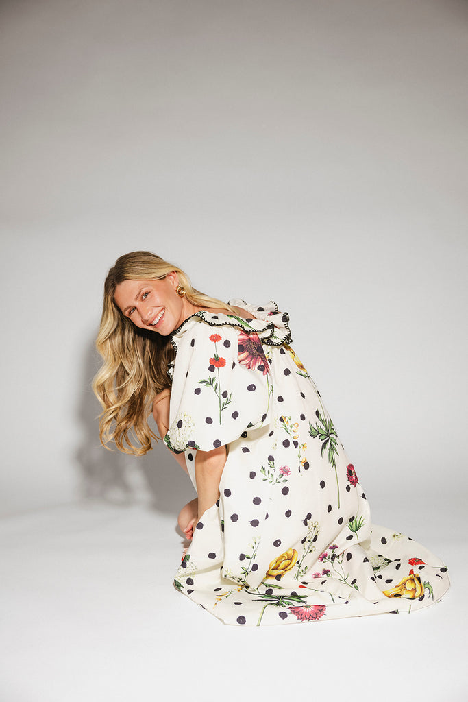 a polka dot puff sleeve dress with floral print details. the perfect polka dot midi dress for baby showers, family pictures, + special occasions. 
