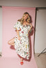 a polka dot puff sleeve dress with floral print details. the perfect polka dot midi dress for baby showers, family pictures, + special occasions. 
