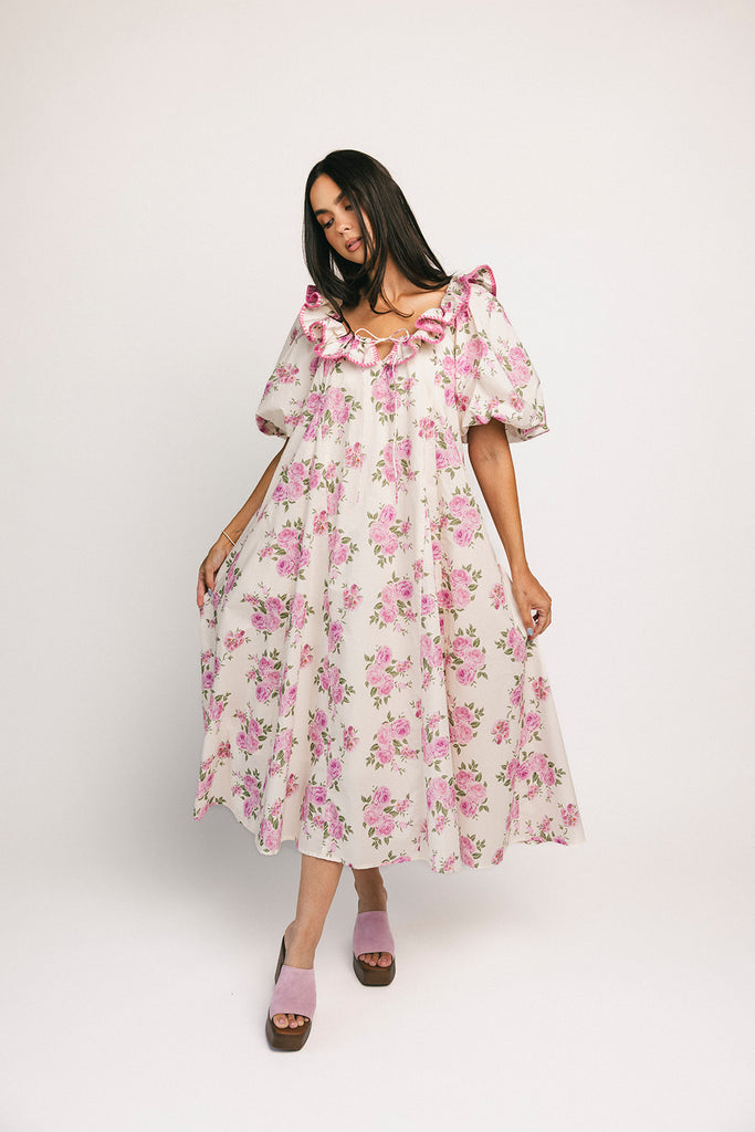 a pink floral puff sleeve dress with a ruffle neckline. the perfect vintage-inspired dress for baby showers, family pictures, + special occasions.
