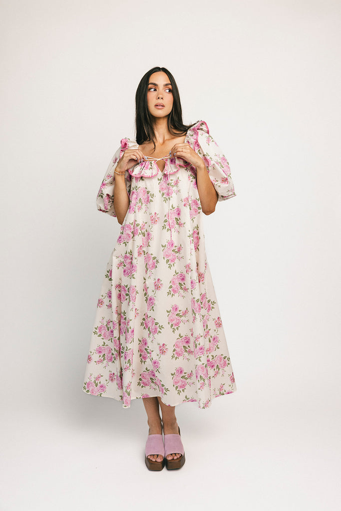 a pink floral puff sleeve dress with a ruffle neckline. the perfect vintage-inspired dress for baby showers, family pictures, + special occasions.
