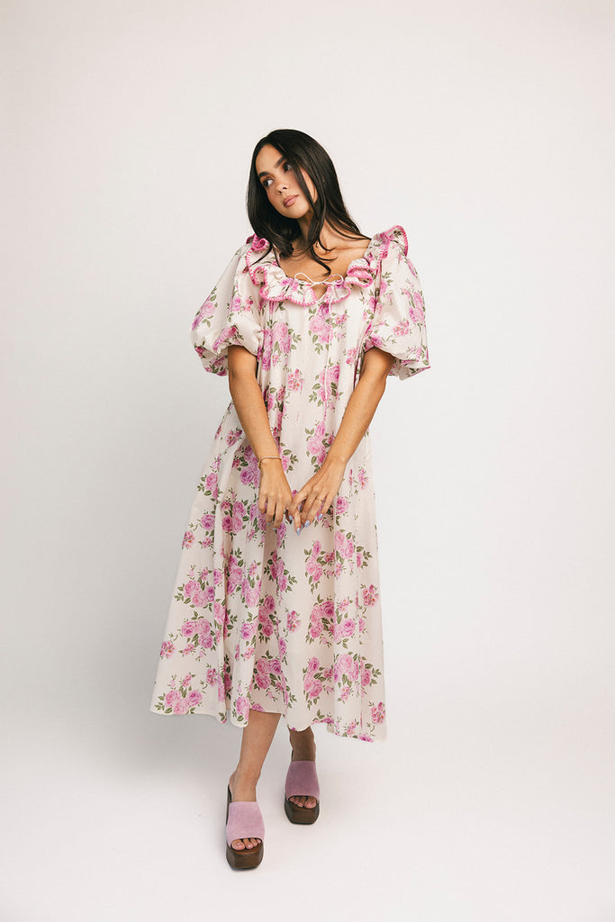 a pink floral puff sleeve dress with a ruffle neckline. the perfect vintage-inspired dress for baby showers, family pictures, + special occasions.

