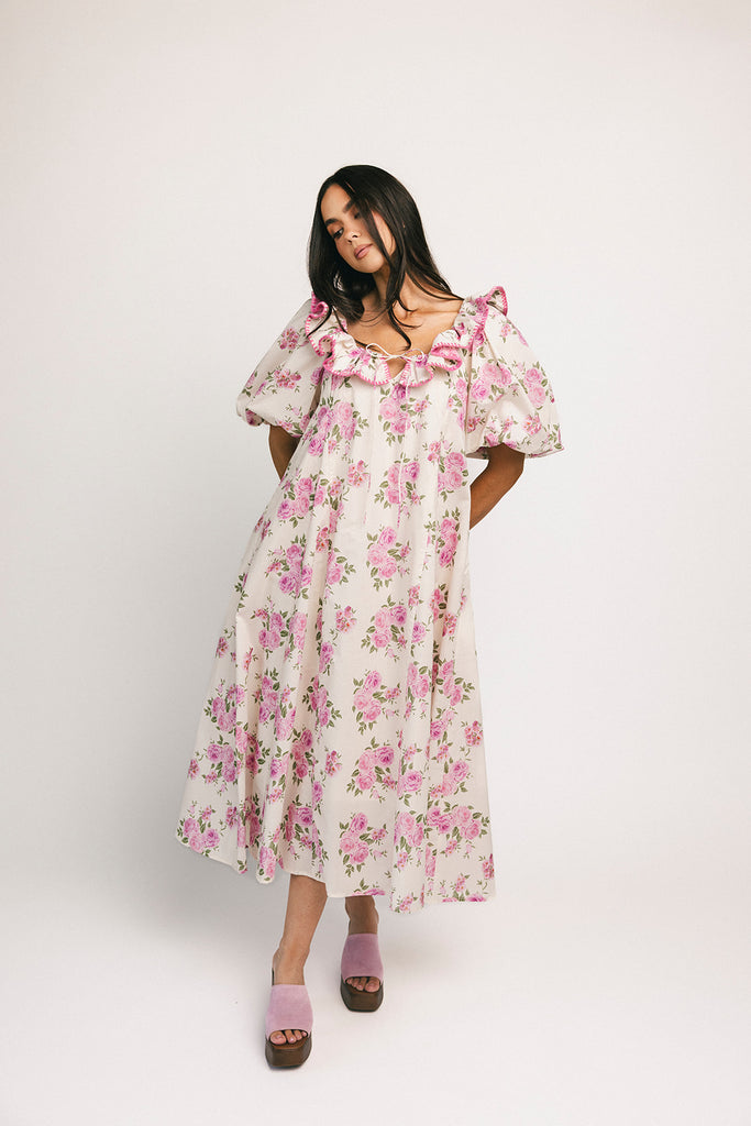 a pink floral puff sleeve dress with a ruffle neckline. the perfect vintage-inspired dress for baby showers, family pictures, + special occasions.
