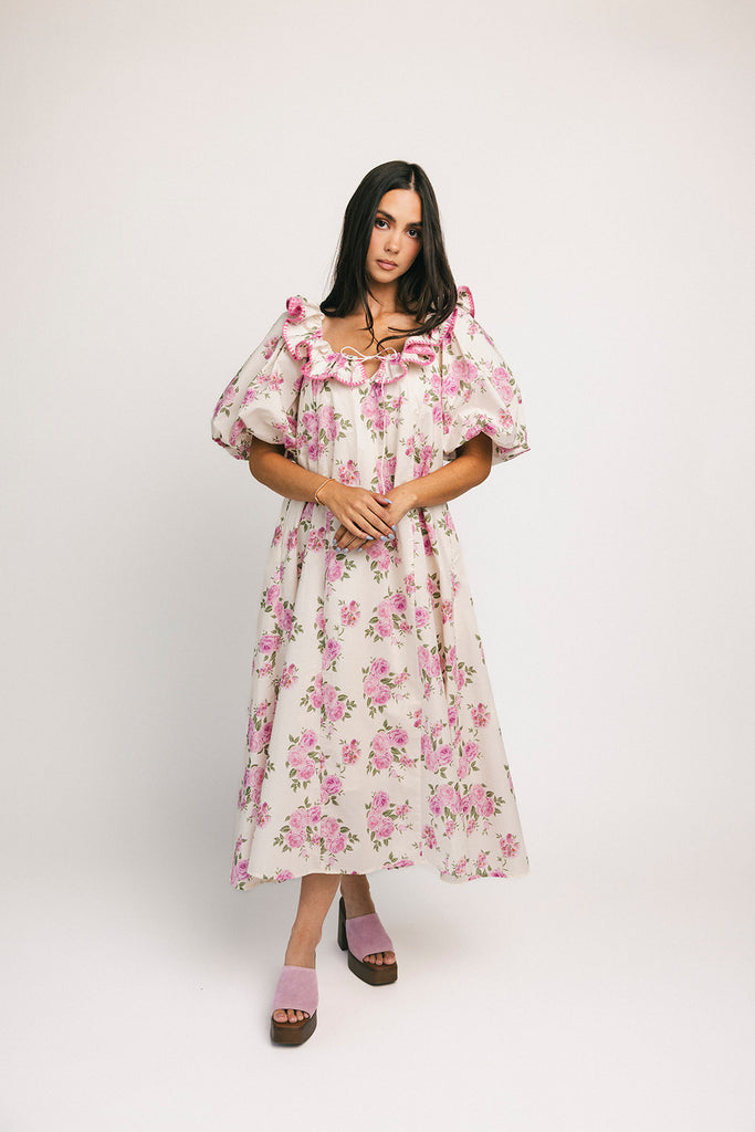 a pink floral puff sleeve dress with a ruffle neckline. the perfect vintage-inspired dress for baby showers, family pictures, + special occasions.
