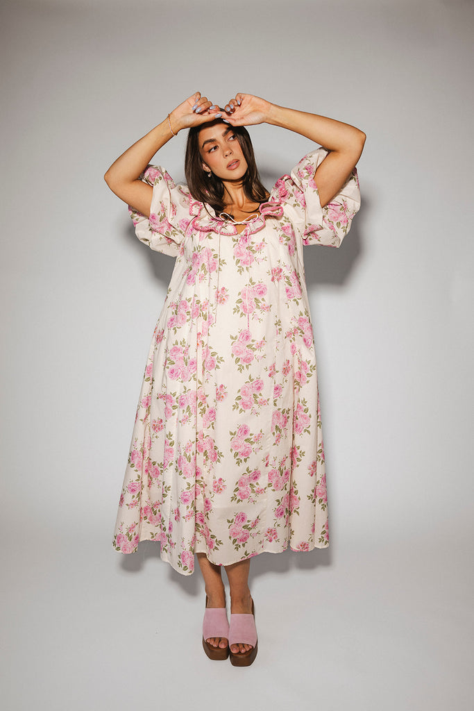 a pink floral puff sleeve dress with a ruffle neckline. the perfect vintage-inspired dress for baby showers, family pictures, + special occasions.
