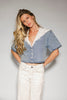 a short sleeve denim top with an oversized lace collar + a cropped silhouette. the perfect button up denim top to dress up or down for any outfit idea.

