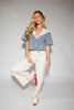 a short sleeve denim top with an oversized lace collar + a cropped silhouette. the perfect button up denim top to dress up or down for any outfit idea.
