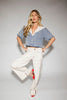 a short sleeve denim top with an oversized lace collar + a cropped silhouette. the perfect button up denim top to dress up or down for any outfit idea.
