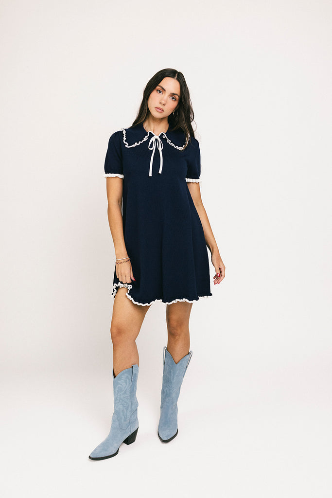 a short sleeve knit mini dress with a ruffled collar + bow detail. the perfect navy knit dress for date nights, family pictures, + everyday wear.
