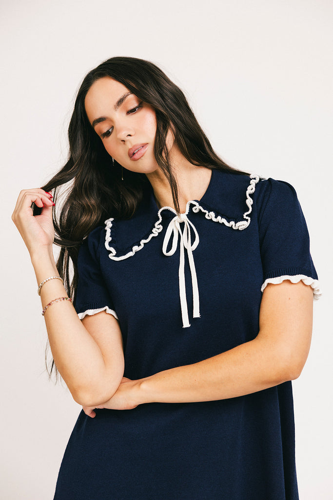 a short sleeve knit mini dress with a ruffled collar + bow detail. the perfect navy knit dress for date nights, family pictures, + everyday wear.
