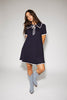 a short sleeve knit mini dress with a ruffled collar + bow detail. the perfect navy knit dress for date nights, family pictures, + everyday wear.
