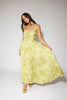 a flowy v-waist green dress with a sleek scoop neckline + subtle floral print. the perfect vintage-inspired maxi dress for weddings, bridal showers, + garden parties.
