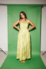a flowy v-waist green dress with a sleek scoop neckline + subtle floral print. the perfect vintage-inspired maxi dress for weddings, bridal showers, + garden parties.
