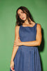 a vintage-inspired denim dress with a boat neckline + a v-shaped waistline. the perfect denim midi dress for family pictures, brunch dates, + special occasions. 
