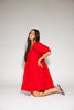 zoco daymaker dress: a short puff sleeve dress with an elastic neckline. the perfect red cotton dress for family pictures, weddings, and baby showers.
