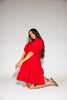 zoco daymaker dress: a short puff sleeve dress with an elastic neckline. the perfect red cotton dress for family pictures, weddings, and baby showers.
