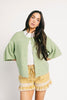 light green short sleeve cardigan with a slouchy, relaxed fit. perfect for casual outfits + lightweight layering.
