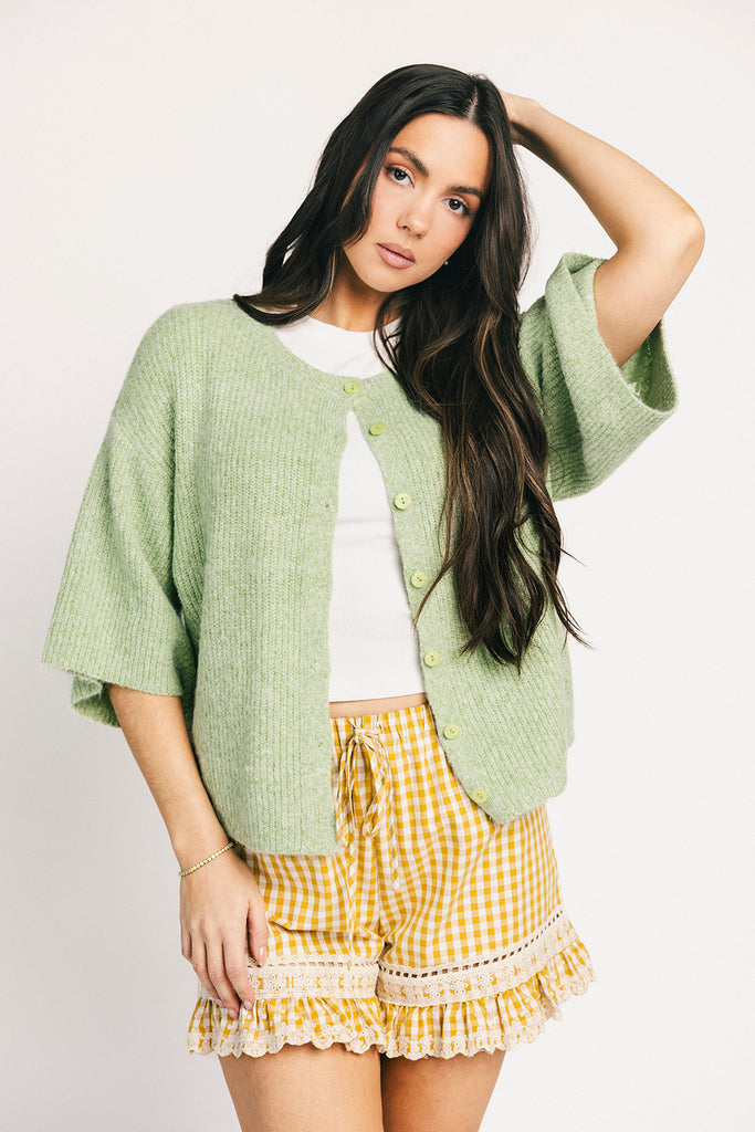 a classic plain white baby tee with a slightly cropped silhouette. the perfect fitted white t-shirt for everyday wear + casual outfit styling.
