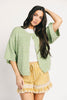 light green short sleeve cardigan with a slouchy, relaxed fit. perfect for casual outfits + lightweight layering.

