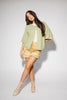light green short sleeve cardigan with a slouchy, relaxed fit. perfect for casual outfits + lightweight layering.
