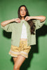 light green short sleeve cardigan with a slouchy, relaxed fit. perfect for casual outfits + lightweight layering.

