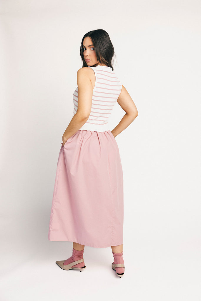 a-line pink midi dress with a striped knit vest detail. the perfect casual dress for baby showers, brunch dates, + family pictures.
