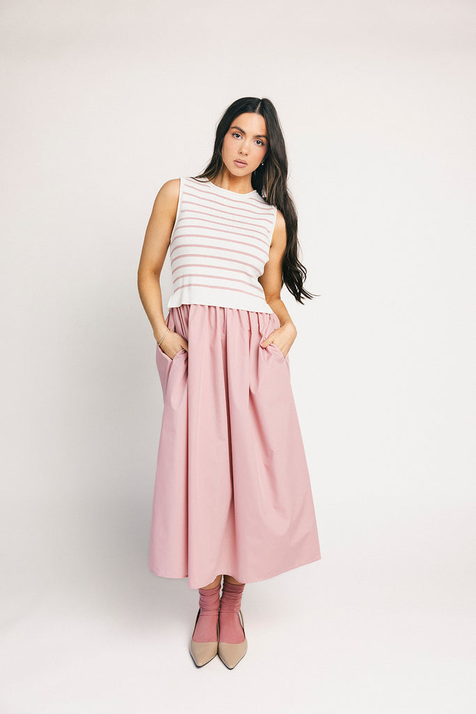 a-line pink midi dress with a striped knit vest detail. the perfect casual dress for baby showers, brunch dates, + family pictures.
