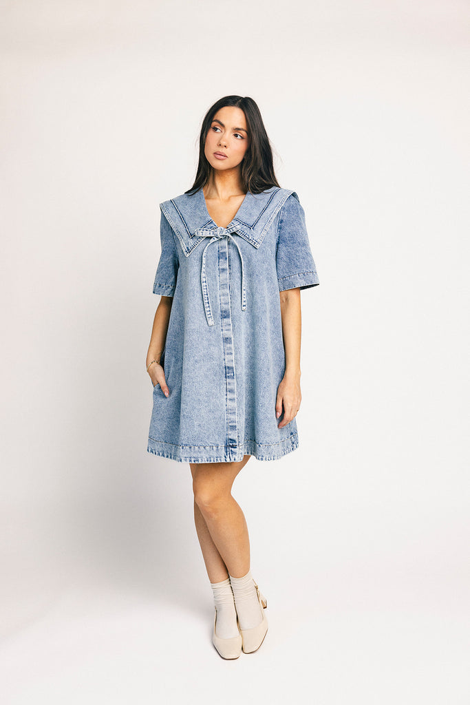 vintage-inspired short sleeve denim dress with an oversized collar + bow detail. the perfect denim mini dress for date nights, family pictures, + everyday wear.
