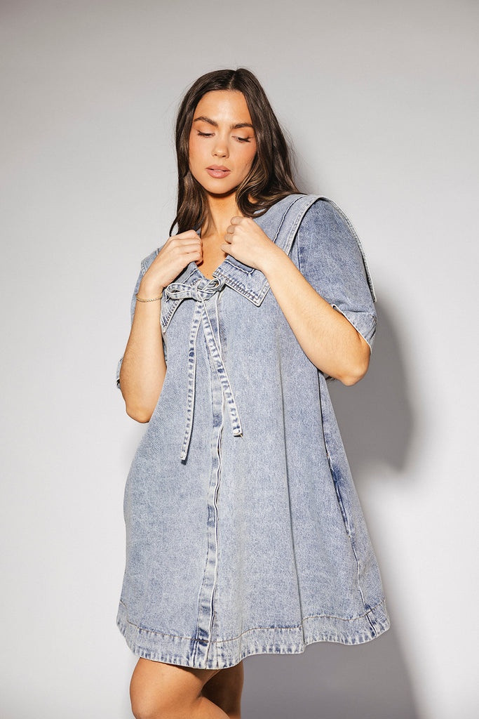 vintage-inspired short sleeve denim dress with an oversized collar + bow detail. the perfect denim mini dress for date nights, family pictures, + everyday wear.
