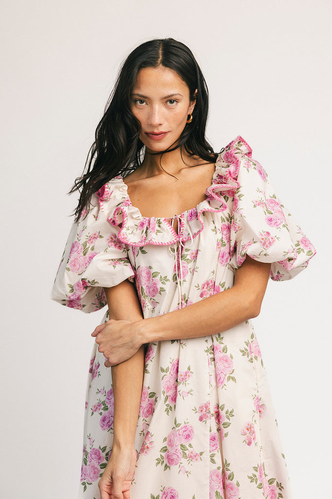 a pink floral puff sleeve dress with a ruffle neckline. the perfect vintage-inspired dress for baby showers, family pictures, + special occasions.
