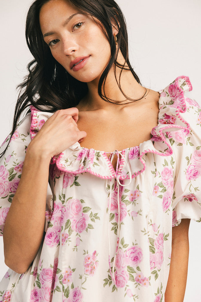 a pink floral puff sleeve dress with a ruffle neckline. the perfect vintage-inspired dress for baby showers, family pictures, + special occasions.

