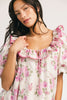 a pink floral puff sleeve dress with a ruffle neckline. the perfect vintage-inspired dress for baby showers, family pictures, + special occasions.
