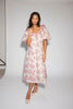 a pink floral puff sleeve dress with a ruffle neckline. the perfect vintage-inspired dress for baby showers, family pictures, + special occasions.
