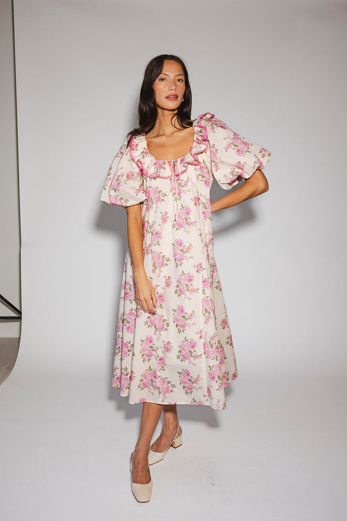 a pink floral puff sleeve dress with a ruffle neckline. the perfect vintage-inspired dress for baby showers, family pictures, + special occasions.
