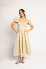 vintage-inspired puff sleeve dress with a muted yellow floral pattern. the perfect puff sleeve midi dress for weddings, bridal showers, + semi-formal events.