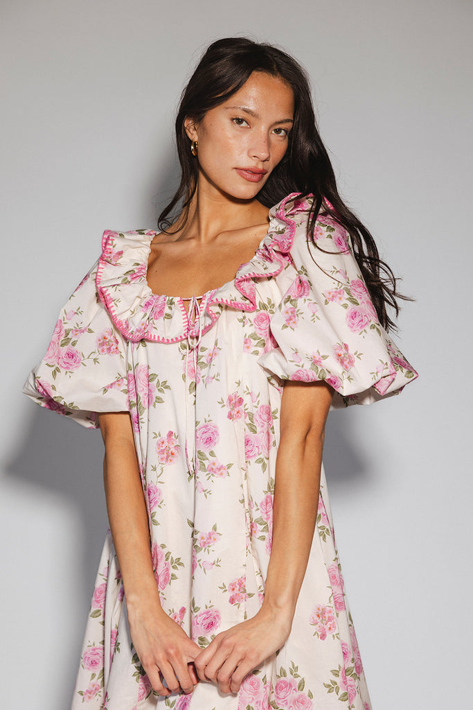 a pink floral puff sleeve dress with a ruffle neckline. the perfect vintage-inspired dress for baby showers, family pictures, + special occasions.
