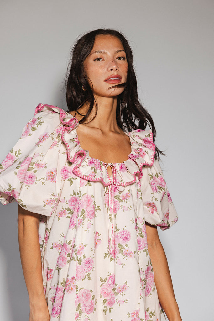 a pink floral puff sleeve dress with a ruffle neckline. the perfect vintage-inspired dress for baby showers, family pictures, + special occasions.
