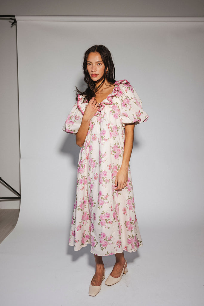 a pink floral puff sleeve dress with a ruffle neckline. the perfect vintage-inspired dress for baby showers, family pictures, + special occasions.
