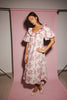 a pink floral puff sleeve dress with a ruffle neckline. the perfect vintage-inspired dress for baby showers, family pictures, + special occasions.
