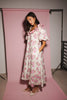 a pink floral puff sleeve dress with a ruffle neckline. the perfect vintage-inspired dress for baby showers, family pictures, + special occasions.
